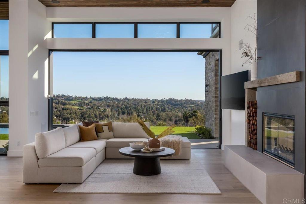 2920 Lone Jack Road Encinitas, CA 92024 - Photo 8 of 23 a living room with furniture and a fireplace