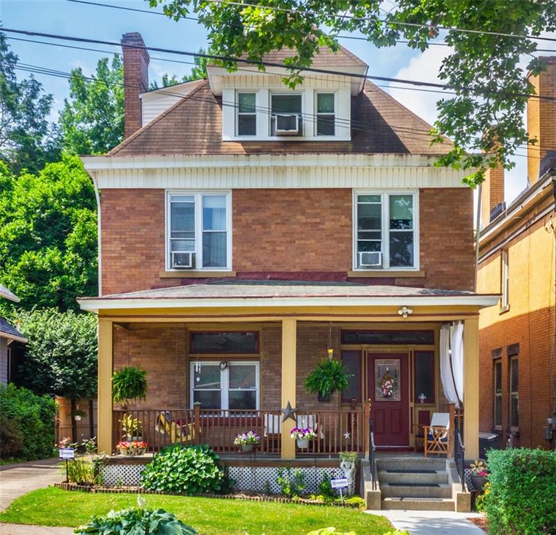 2114 Hampton Street Pittsburgh, PA 15218 - Photo 1 of 28 a front view of a house with garden