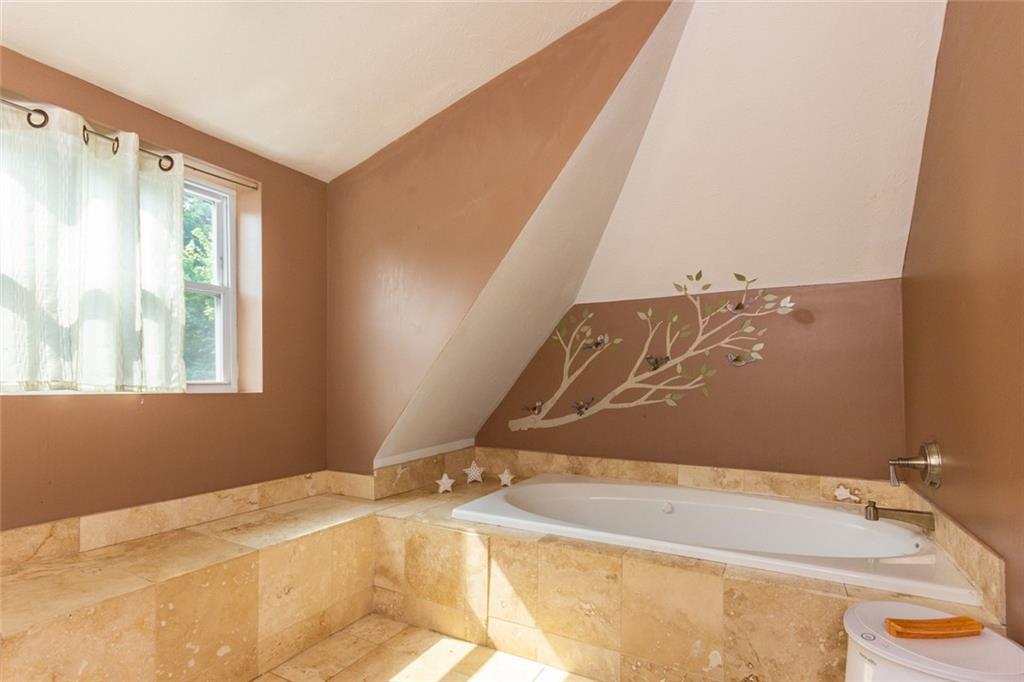 2114 Hampton Street Pittsburgh, PA 15218 - Photo 17 of 28 a bathroom with a tub sink and curtain