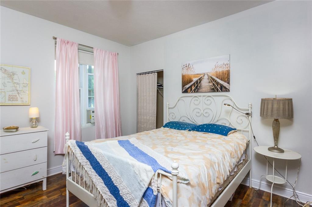 2114 Hampton Street Pittsburgh, PA 15218 - Photo 20 of 28 a bedroom with a bed and a table in it