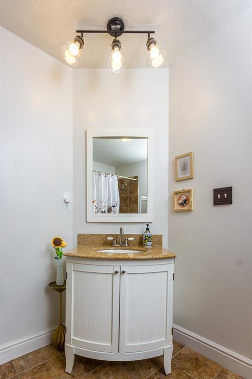 2114 Hampton Street Pittsburgh, PA 15218 - Photo 24 of 28 a bathroom with a granite countertop sink and a mirror