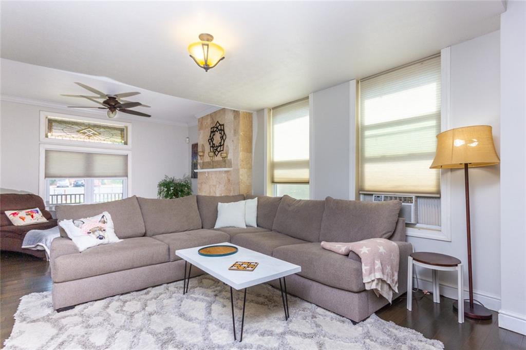 2114 Hampton Street Pittsburgh, PA 15218 - Photo 5 of 28 a living room with furniture and a lamp