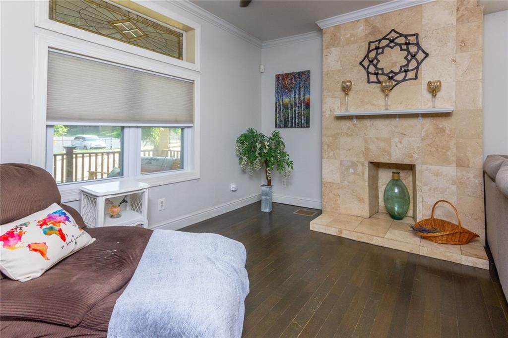 2114 Hampton Street Pittsburgh, PA 15218 - Photo 6 of 28 a living room with furniture and a fireplace