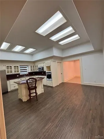 a view of kitchen with furniture and wooden floor