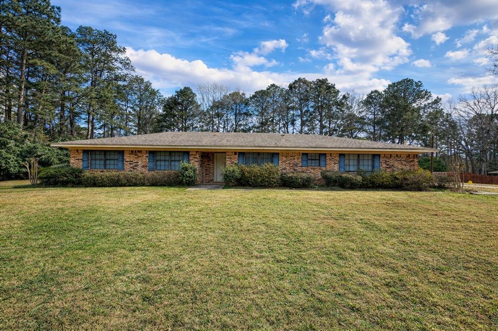 166 East Colbert Drive Minden, LA 71055 - Photo 1 of 1 a front view of a house with a yard