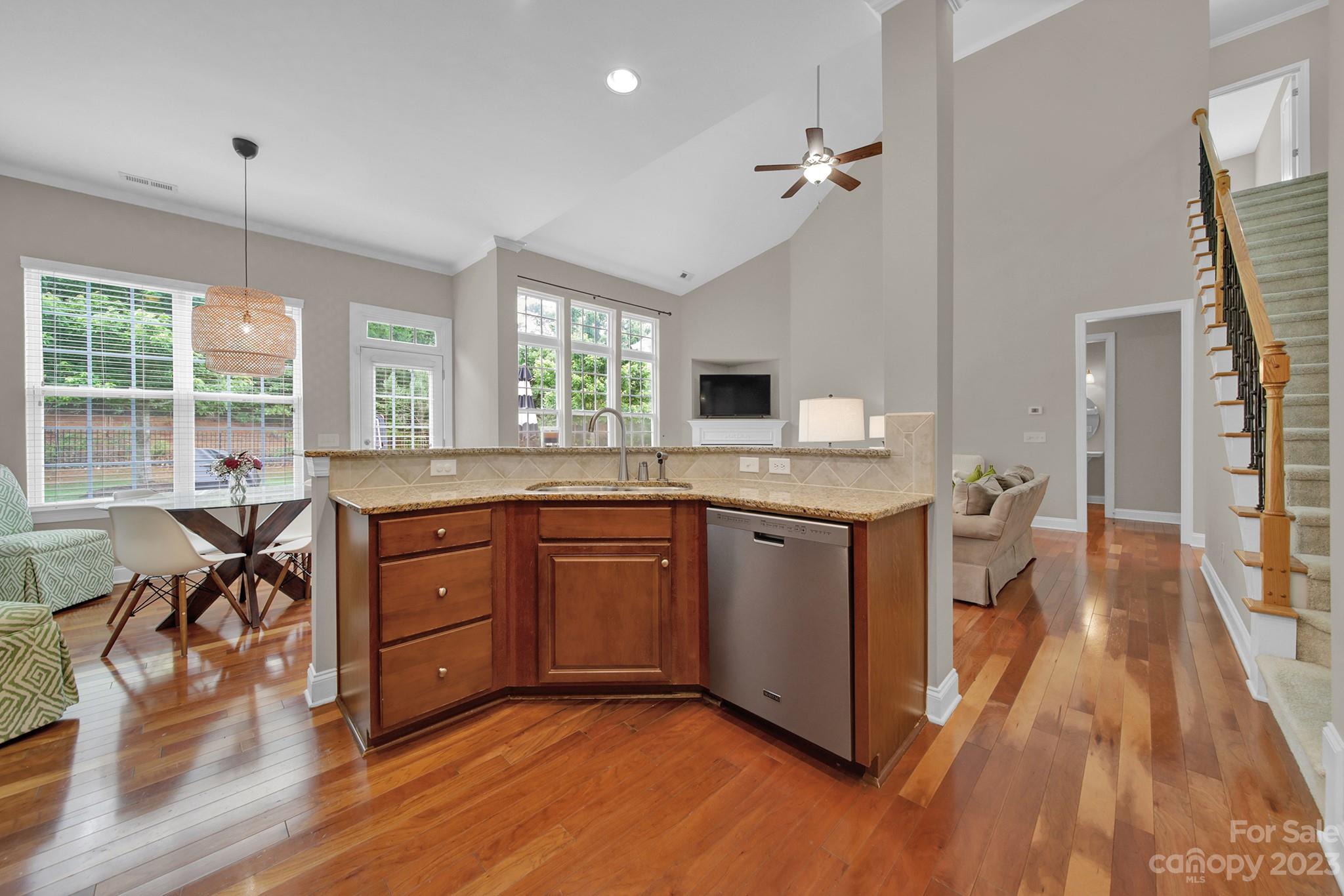 1362 Secret Path Drive Fort Mill, SC 29708 - Photo 16 of 47 a kitchen with granite countertop a stove and a wooden floors