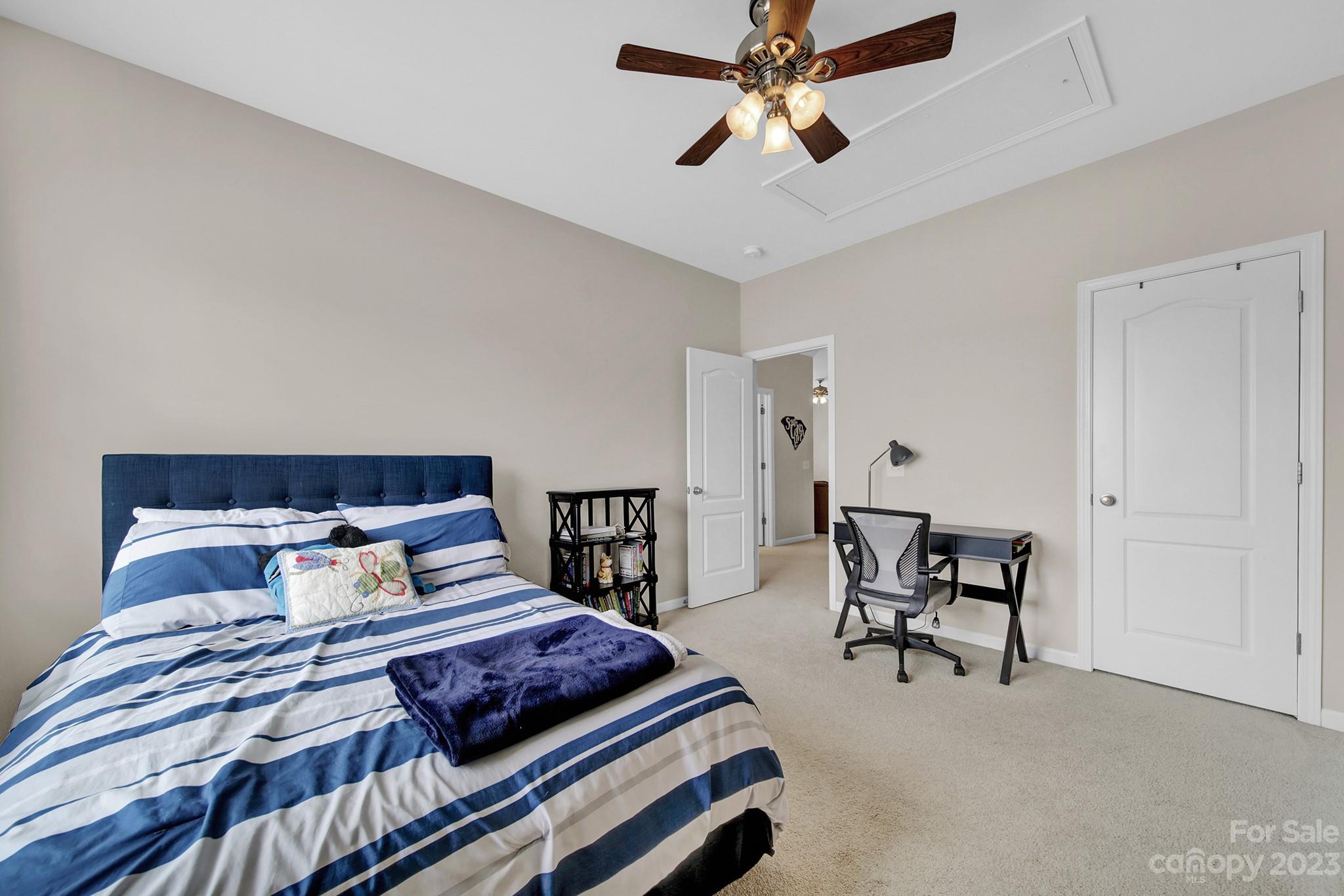 1362 Secret Path Drive Fort Mill, SC 29708 - Photo 27 of 47 a bedroom with furniture and a chandelier