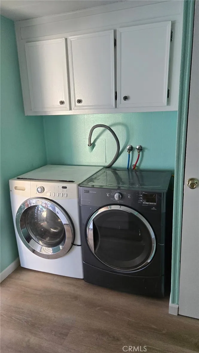 2499 Gerard Merced, CA 95341 - Photo 12 of 14 a utility room with a sink and a washer dryer