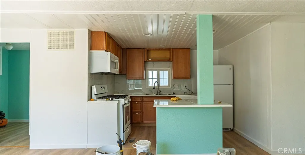 2499 Gerard Merced, CA 95341 - Photo 4 of 14 a kitchen with a sink and a refrigerator