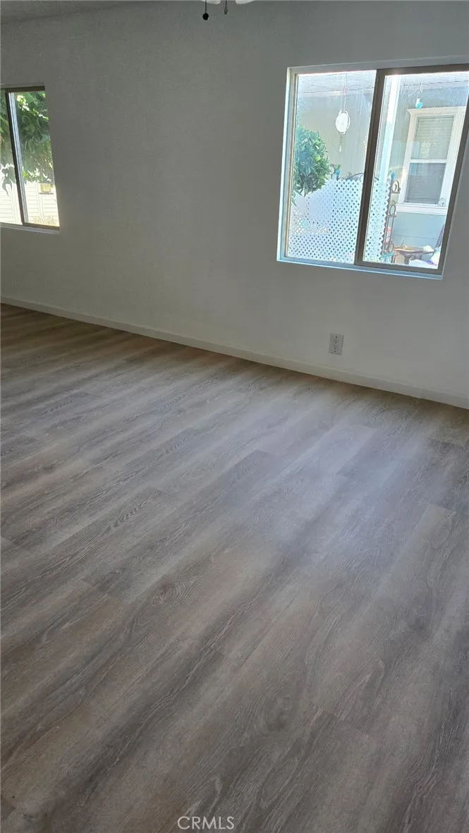 2499 Gerard Merced, CA 95341 - Photo 5 of 14 an empty room with wooden floor and windows