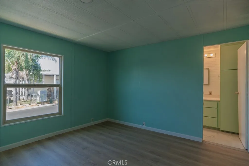 2499 Gerard Merced, CA 95341 - Photo 7 of 14 an empty room with wooden floor and windows