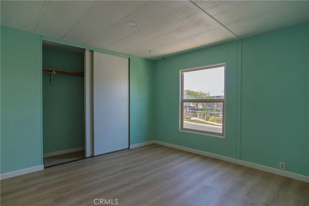 2499 Gerard Merced, CA 95341 - Photo 8 of 14 an empty room with wooden floor and a window