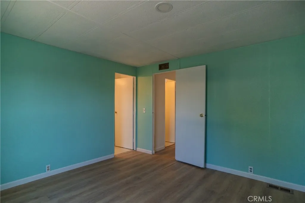 2499 Gerard Merced, CA 95341 - Photo 9 of 14 an empty room with wooden floor and closet
