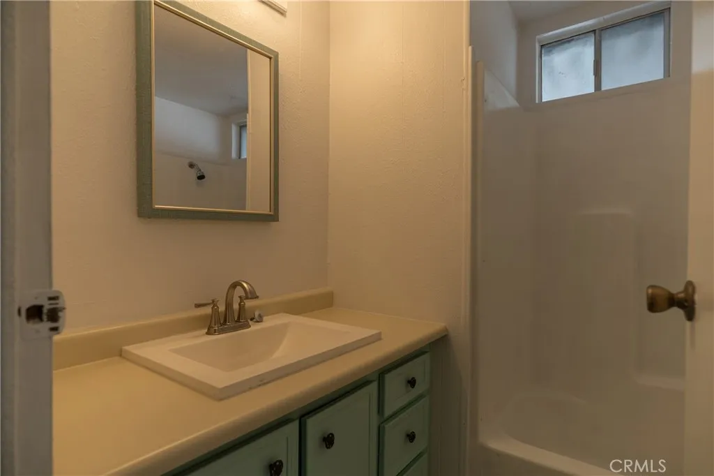 2499 Gerard Merced, CA 95341 - Photo 10 of 14 a bathroom with a sink and mirror