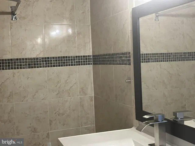a bathroom with a sink and a shower