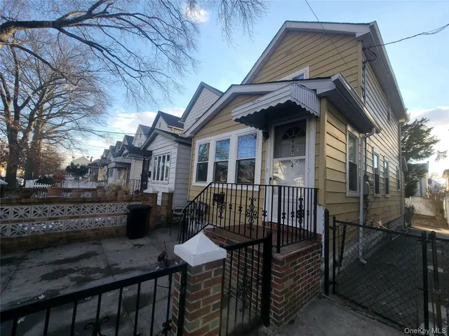 a view of house with a roof deck