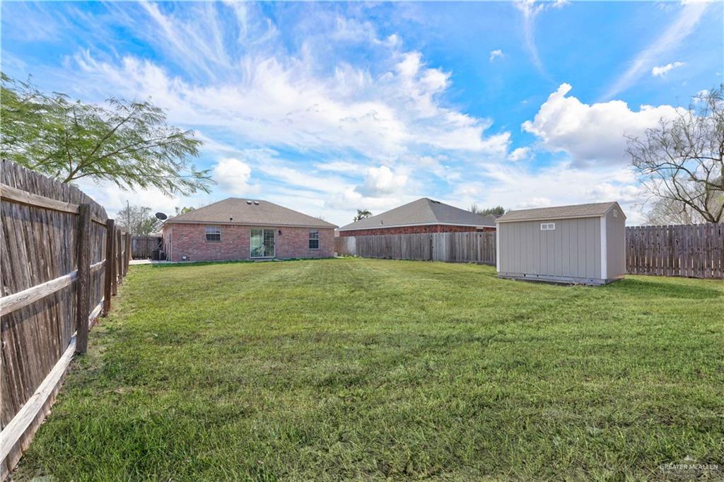 710 Sherryl Avenue Pharr, TX 78577 - Photo 13 of 13 a front view of house with yard and trees in the background