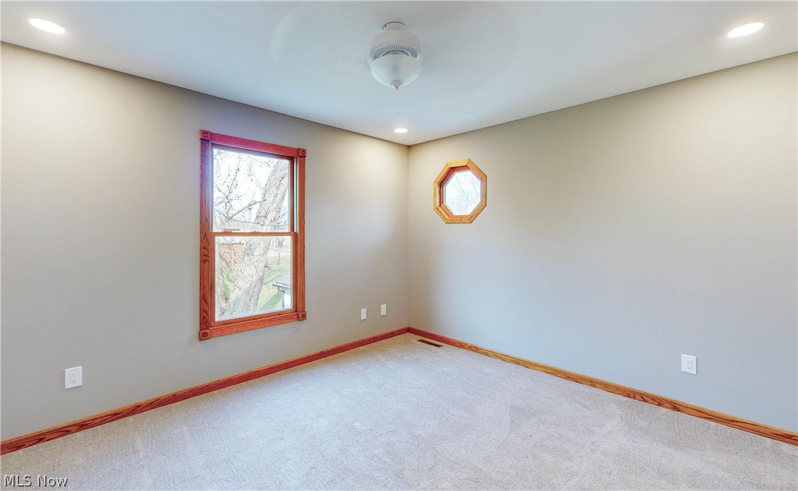 2081 Stroup Road Atwater, OH 44201 - Photo 30 of 48 Empty room with carpet floors and ceiling fan