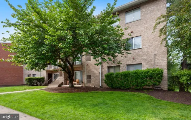 a view of a house with backyard sitting area and garden