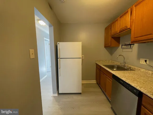 a kitchen with a stove and a sink
