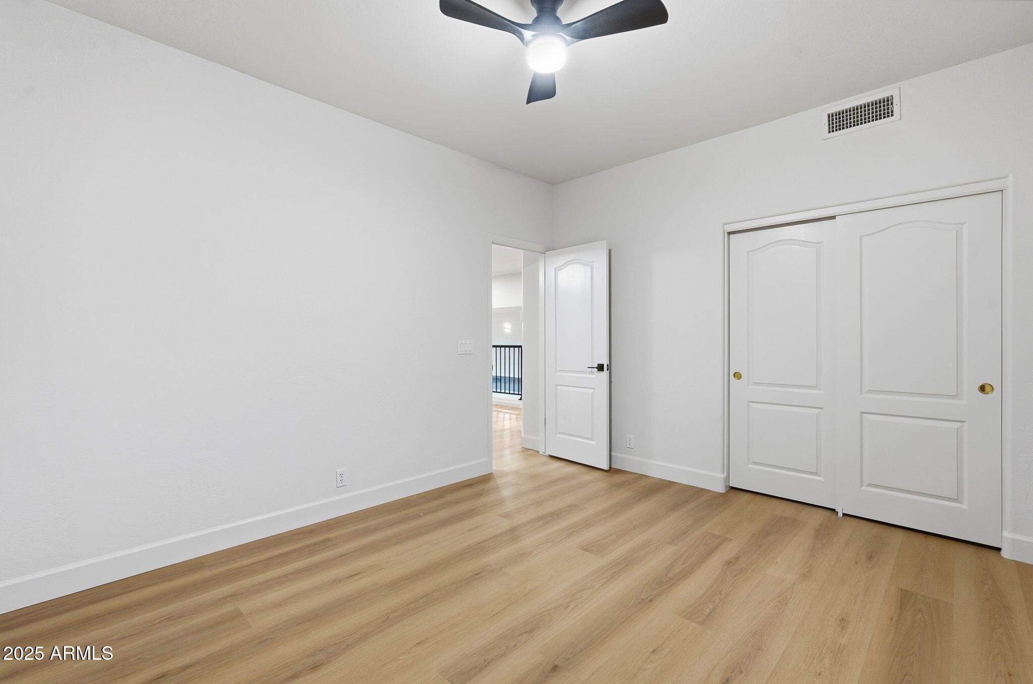 13232 North 12th Place Phoenix, AZ 85022 - Photo 23 of 32 a view of an empty room and wooden floor