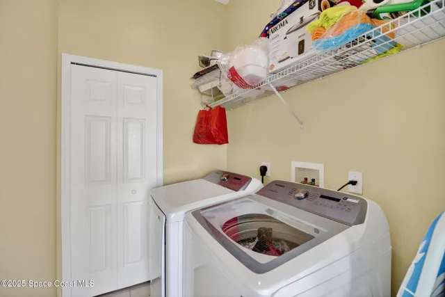 a utility room with dryer and washer