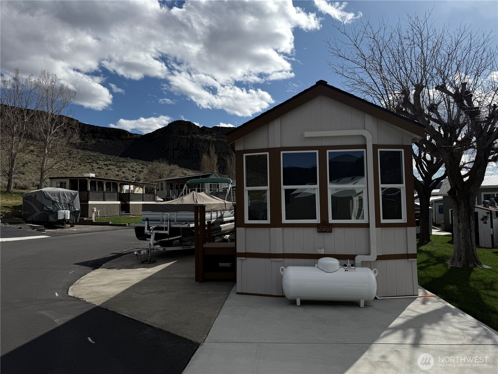 31465 Moore Road Northeast, Unit 801 Coulee City, WA 99115 - Photo 35 of 38 a front view of a house with cars parked
