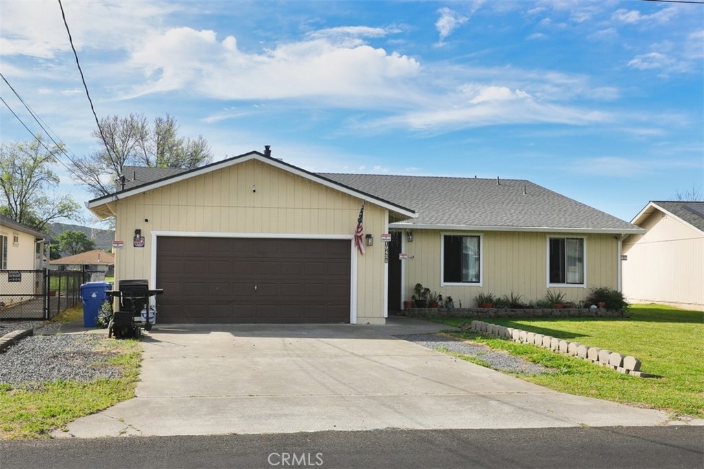 19425 Old Creek Road Hidden Valley Lake, CA 95467 - Photo 1 of 41 a front view of a house with a yard