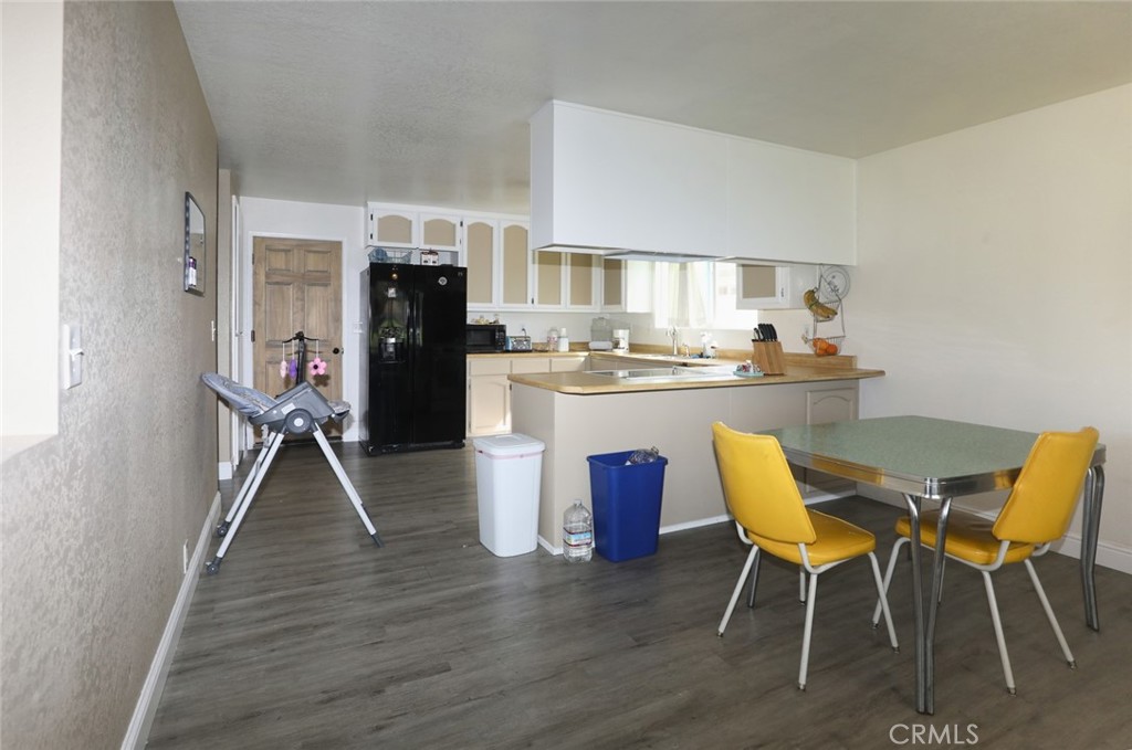 19425 Old Creek Road Hidden Valley Lake, CA 95467 - Photo 12 of 41 a dining room with furniture and wooden floor