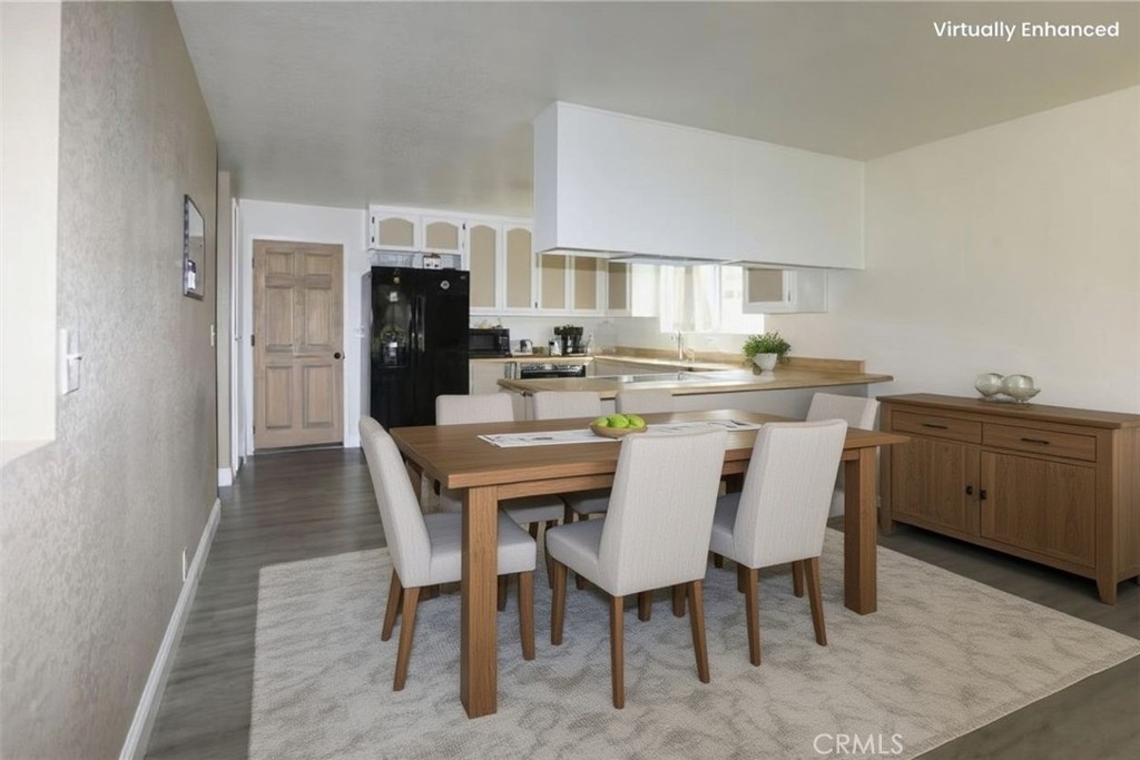 19425 Old Creek Road Hidden Valley Lake, CA 95467 - Photo 13 of 41 a kitchen with a dining table chairs refrigerator and cabinets