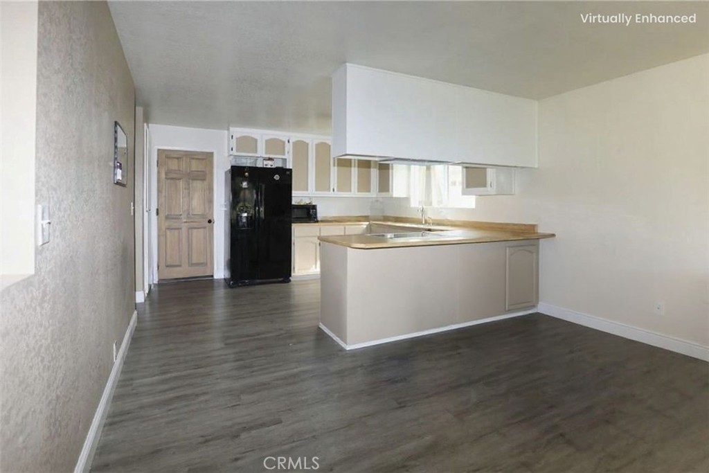 19425 Old Creek Road Hidden Valley Lake, CA 95467 - Photo 14 of 41 a view of kitchen and empty room with wooden floor