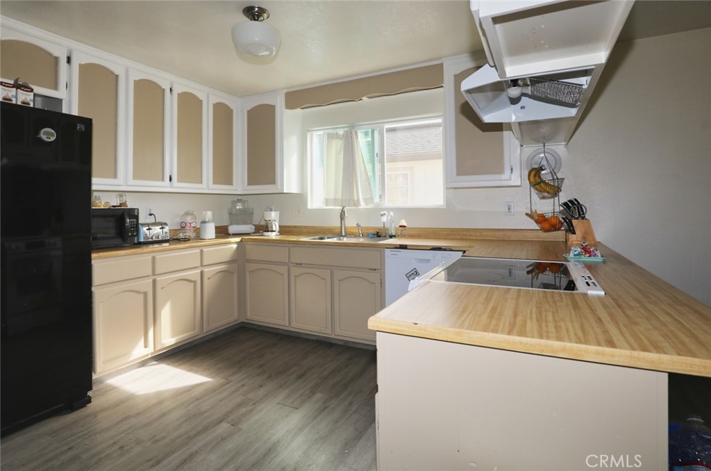 19425 Old Creek Road Hidden Valley Lake, CA 95467 - Photo 10 of 41 a kitchen with a sink appliances and cabinets