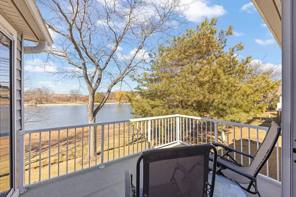 a view of a chairs and table in the balcony