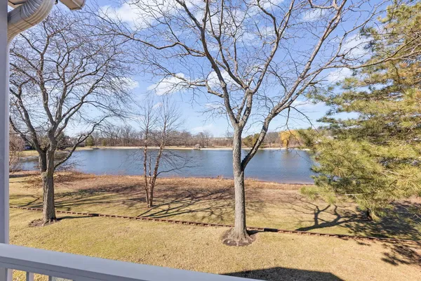 a backyard of a house with large trees
