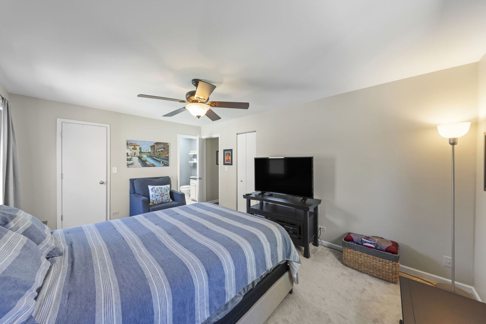 -n204 Windermere Road, Unit 2708 Winfield, IL 60190 - Photo 17 of 36 a bedroom with a bed and a flat screen tv