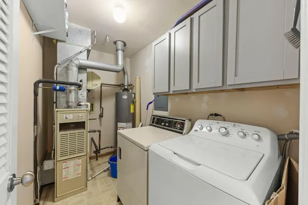 a view of storage and utility room with washer and dryer