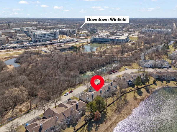an aerial view of a gallery with table and chairs