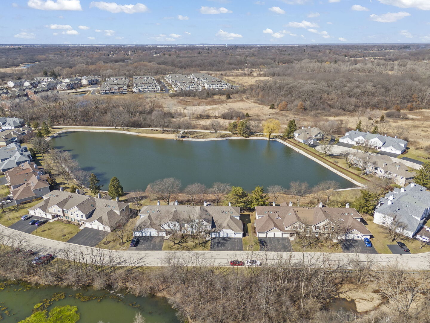 -n204 Windermere Road, Unit 2708 Winfield, IL 60190 - Photo 25 of 36 an aerial view of a house with a lake view