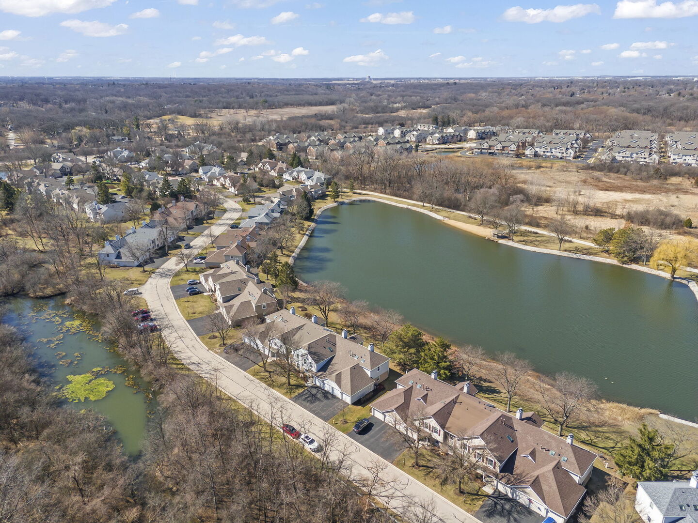 -n204 Windermere Road, Unit 2708 Winfield, IL 60190 - Photo 26 of 36 an aerial view of a houses with a lake