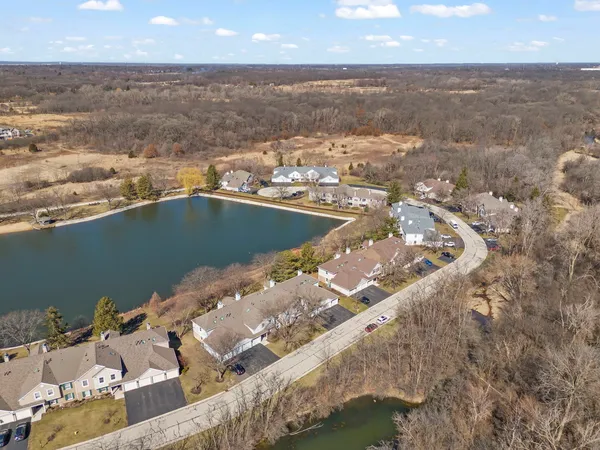 an aerial view of residential houses with outdoor space
