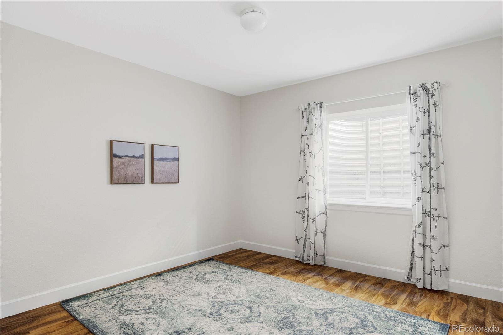2908 Ironton Street Denver, CO 80238 - Photo 22 of 30 a view of empty room with window