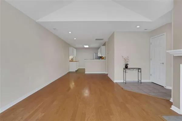 an empty room with windows and entrance