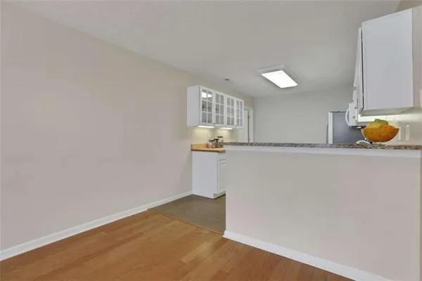 a kitchen with stainless steel appliances granite countertop a refrigerator sink and cabinets