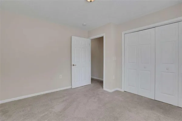 a bathroom with a sink vanity mirror and toilet