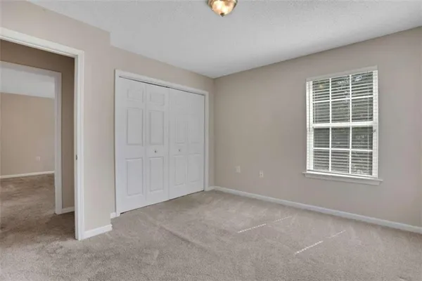 a bathroom with a bath tub with a shower