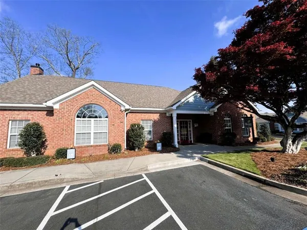a view of a swimming pool with a patio