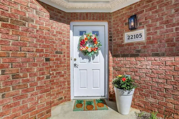 a bunch of flowers in front of a door