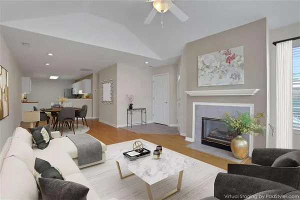 a living room with furniture and a fireplace