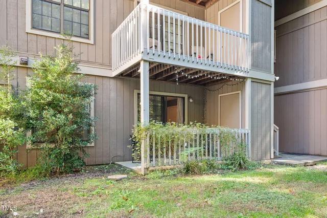 a view of a house with brick walls