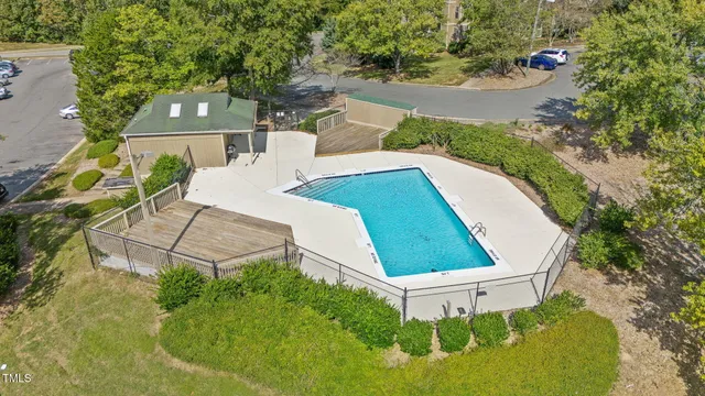an aerial view of a house with outdoor space and street view
